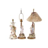 A pair of late 19th-century Continental porcelain figural table lamps ,one mounted with a young