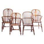 A group of four 19th-century Windsor elm and ash open armchairs with hoop backs and shaped splats