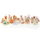 Fifteen Beswick Beatrix Potter figures, a Beswick figure of Rupert Bear and a Kitty MacBride Beswick