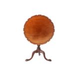A George III mahogany piecrust edged circular snap top tripod table, with birdcage and gadrooned urn