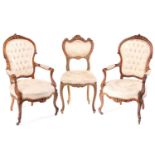 A pair of Louis XV style figured rosewood fauteuils, second half of the 19th century, with carved