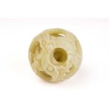 A Chinese-carved pale green jade five-layer puzzle ball, 20th/21st century, the exterior carved with