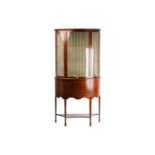 An Edwardian satinwood banded mahogany demi lune standing vitrine, possibly by Maple & Co, with