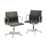 A pair of Charles Eames vintage ICF (licensed) aluminium group armchairs with dark green hopsack