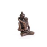 A Tibetan bronze figure of the Buddha & Consort Samantabadra in a loving embrace, the base with a