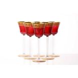 A set of six St Louis red crystal glass thistle design Hock glasses, sealed in the original box, box