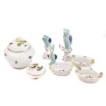 A small collection of Herend porcelain, comprising an owl on tree stump, a pelikan, a parrot,
