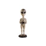 A large late 20th-century composite figure of an alien, modelled as a floor lamp (lacking globe), 95