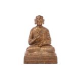 A gilt-bronze figure of the Buddha seated in Vitaka mudra on a simple rectangular plinth. 17 cm wide