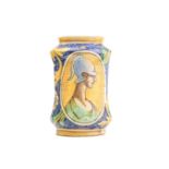 An Albarello dry drug jar, of waisted form, with figural yellow panels within floral scroll