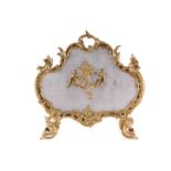 A Louis XV style gilt metal firescreen, of shaped foliate scroll design to the centre depicting