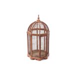 A large domed circular section parrot cage, 20th century, with decorative finial and wirework