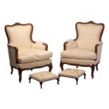 A pair of Louis XV style walnut Bergere armchairs with rose carved cresting and moulded frame with