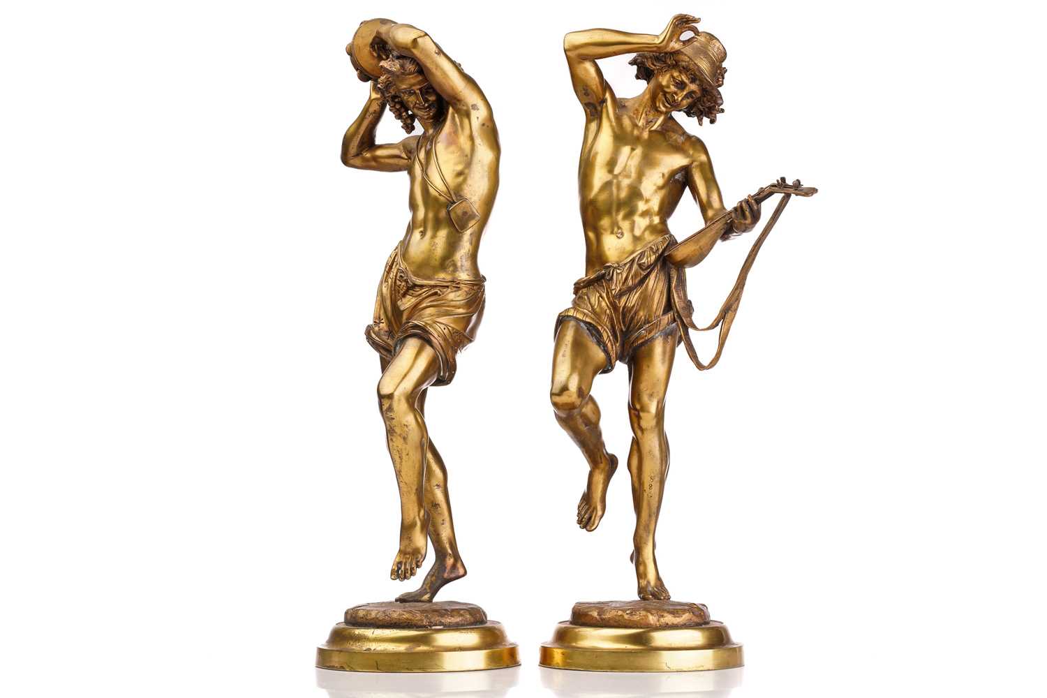 Albert Ernest Carrier-Belleuse (1824 - 1887), a pair of gilt bronze figures of Neapolitan musicians,