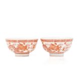 A pair of Chinese porcelain Dragon & Fenghuang bowls, painted in iron red opposing each other facing