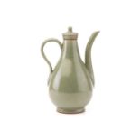 A Chinese Song Dynasty style Celadon wine ewer and cover of baluster form fitted a swan neck spout