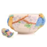 A Clarice Cliff Fantasque design clog in a blue floral design, (with chip), 11 cm long, and a