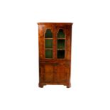 A George II-style corner display cabinet walnut free standing with arched glazed panel doors over