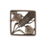 Georg Jensen - A square openwork brooch in silver, depicting two birds perched on a stylised ear