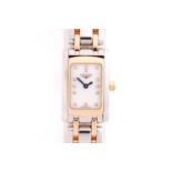 Longines. A lady's mixed metal Dolce Vita wristwatch, rectangular dial with diamond indices;