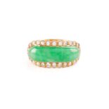 A Chinese saddle ring set with jadeite and diamonds, comprising a saddle-shaped jadeite jade,