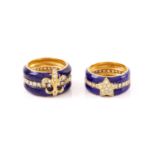 A pair of his and hers enamel ring set with diamonds; they both have shaped band with cobalt blue