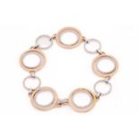 A diamond hoop bracelet, the rose gold and white gold alternating hoop design part grain set with
