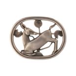 Georg Jensen - A brooch depicting kneeling fawn and flowers, fitted with hinged pin stem and roll-