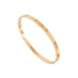 Cartier - A diamond-set 'LOVE' bangle in 18ct yellow gold, slim model, set with ten brilliant-cut