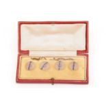 A cased set of four rock crystal and sapphire shirt studs, early 20th century, each of the
