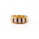 A diamond and sapphire dress ring of stripe design, alternating channel-set rows of table-cut