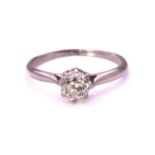 An old-cut diamond solitaire ring, featuring a cushion-shaped old-cut diamond, approximately