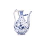 A Chinese porcelain ewer, Persian inspired, of pear form with looping handle, painted with