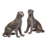 A pair of seated almost life-size bronze melanistic panthers, 20th century, with dark patinated