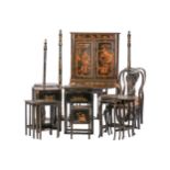 A composite suite of black lacquered furniture decorated with faux Chinese scenes, some possibly