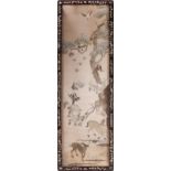 A Japanese silk embroidered panel, depicting deer, birds and a monkey around a tree, in a mother-
