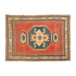 A pale red ground Lori Pambak design soumak carpet with a distinctive central motif within