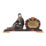 An Art Deco patinated spelter and ivorine figural clock garniture, a young woman modelled seated