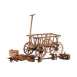 An early 20th-century Belgian rustic wooden dog cart, with iron hooped wheels and a T bar handle.