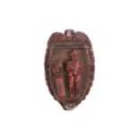 Of Napoleonic interest, an early 19th carved coquilla nut Bugbear snuff box, the hinged lid carved