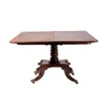 A large William IV mahogany fold-over tea table with radiused corners, the frieze with raised