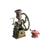 A very large 19th-century cast iron and brass coffee grinder with a classical urn bean hopper with a