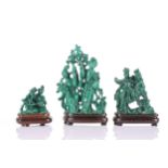 A Chinese malachite figure group, 20th century, carved as two females amongst flowers, one