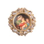 A probably Vienna circular porcelain panel painted with The Madonna Della Sedia, within a carved