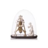 A late Victorian brass skeleton timepiece under a glass dome with ebonized base