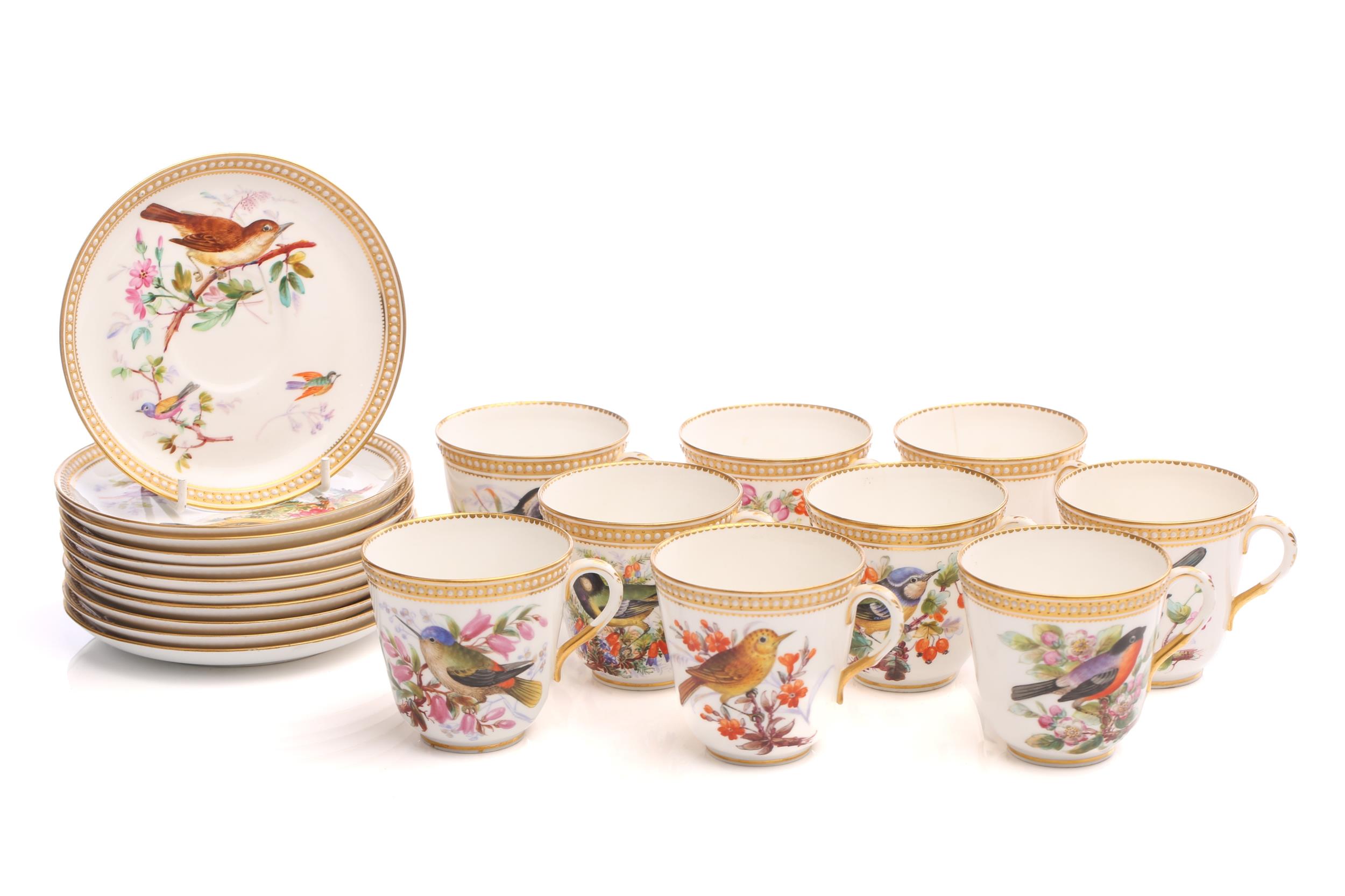 A Royal Worcester set of nine tea cups and saucers and a further two saucers, with gilt and beaded