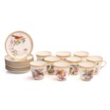 A Royal Worcester set of nine tea cups and saucers and a further two saucers, with gilt and beaded