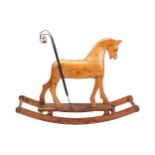 A folk-art carved pine rocking/push-along horse, late 19th /early 20th century, with twisted iron