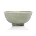 A Chinese Longquan celadon bowl, Ming dynasty, the interior with a faint lotus flower to the centre,