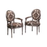 A pair of Louis XVI-style carved wood and "Lacquer a Mecca" fauteuils with moulded frames and